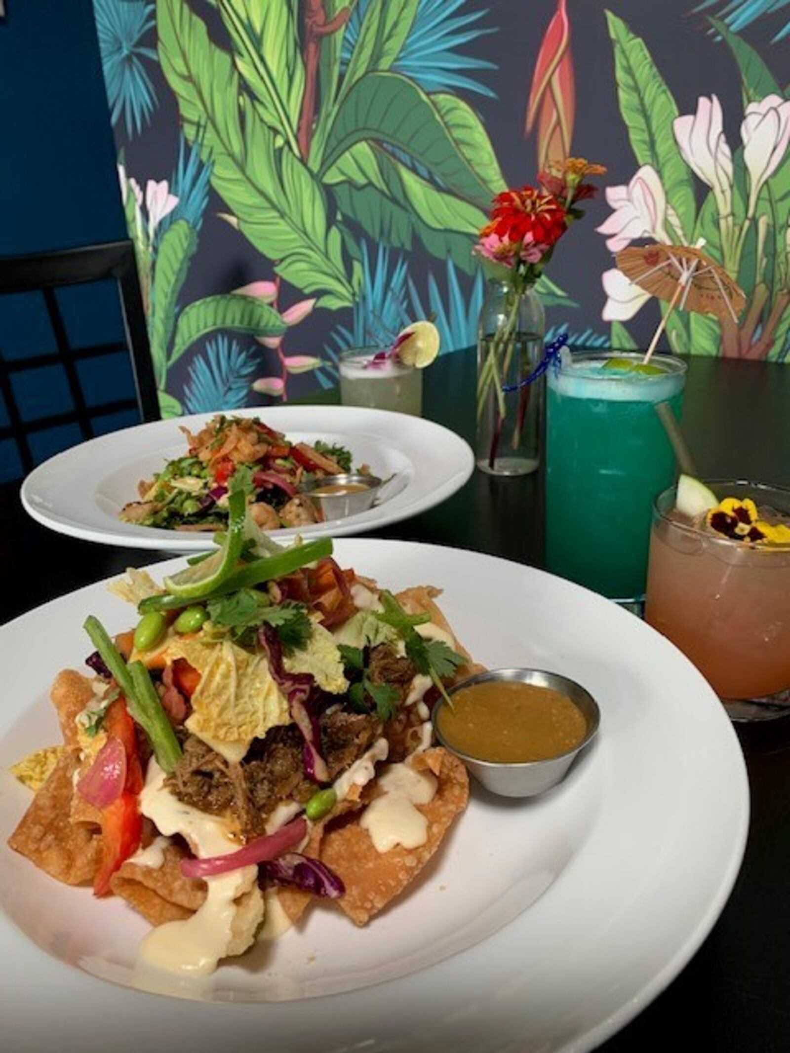 Lily's Bistro in Dayton's Oregon District is finishing its transformation to Lily's Dayton. The new concept, "Good Food, Tasty Cocktails," will blend some of Lily's familiar favorites with a more affordable menu and cocktail list and offers a tiki-inspired theme. ALEXIS LARSEN/CONTRIBUTED PHOTOS