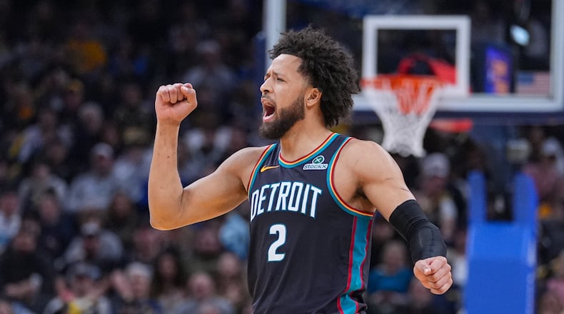Detroit Pistons guard Cade Cunningham (2) celebrates during the first half of an NBA basketball game against the Indiana Pacers in Indianapolis, Monday, Nov. 24, 2025. (AP Photo/Michael Conroy)