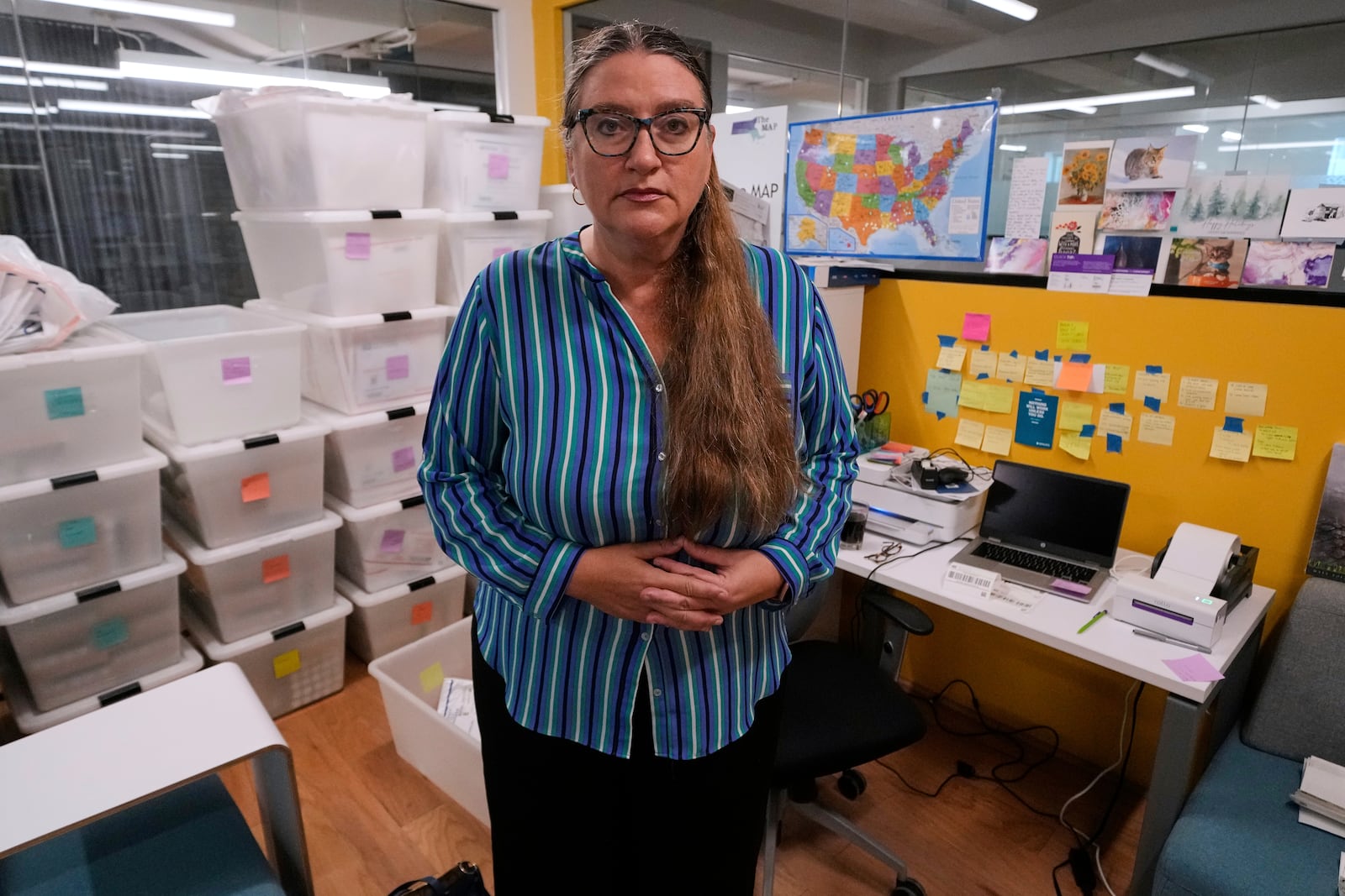 Dr. Angel Foster, co-founder of Massachusetts Medication Abortion Access Project, poses for a photo at the organization's headquarters, May 13, 2025, in Somerville, Mass. (AP Photo/Charles Krupa)