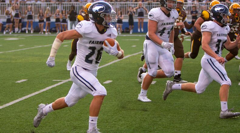 Fairmont's Stevie Doty returns a blocked field goal for a touchdown at the end of the first half Thursday night in the Firebirds' 31-7 victory over Alter at Roush Stadium. CONTRIBUTED/Jeff Gilbert