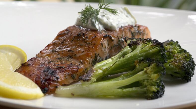 Dill and Sugar Brined Broiled Salmon with roasted broccoli. It can be topped with Cucumber-Yogurt Sauce. (Kathleen Galligan/Detroit Free Press/TNS)