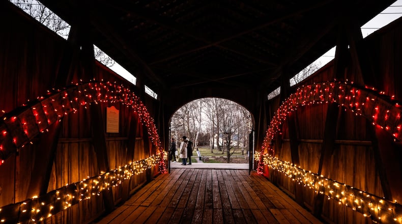 The Carillon Historical Park has transformed into a holiday wonderland. Thousands of light adorn the historic buildings. There are model train displays, gift shops and a bakery. JIM NOELKER/STAFF