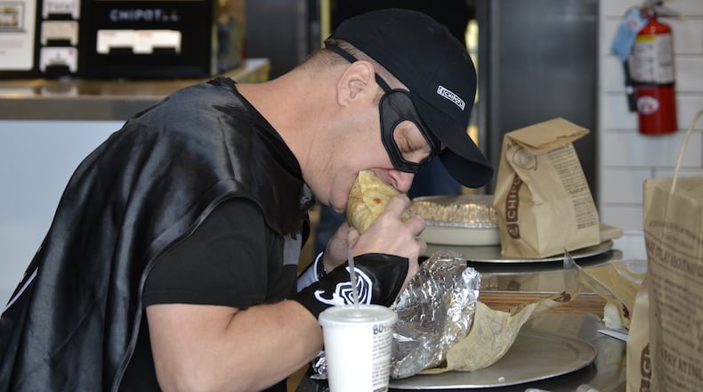 Bruce Wayne, of Tiffin, eats his 426th consecutive Chipotle meal.CONTRIBUTED