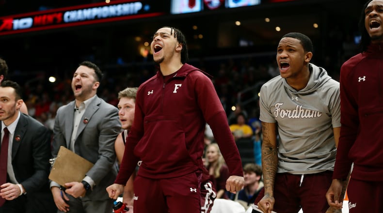 Wayne grad Darius Quisenberry, center, reacts to a Fordham dunk during a game against Davidson on Friday, March 11, 2022, in the quarterfinals of the Atlantic 10 Conference tournament at Capital One Arena in Washington, D.C. David Jablonski/Staff