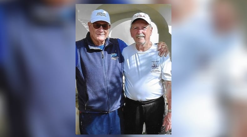 George McCabe (right), of Oxford, repeated as the world champion in both singles and doubles tennis at the Super Senior World Championships held at Palma Mallorca, Spain October 14-21. He is shown with Chuck Nelson, who McCabe defeated for the individual title in the championship match. CONTRIBUTED
