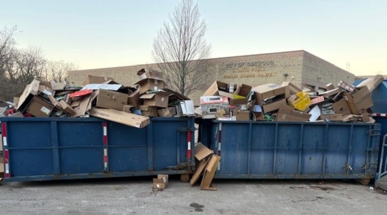 Cardboard boxes are overflowing from blue collection containers Sunday, Dec. 21, 2025, at the public works recycling center, 210 Shafor Blvd. in Oakwood. JEN BALDUF/STAFF