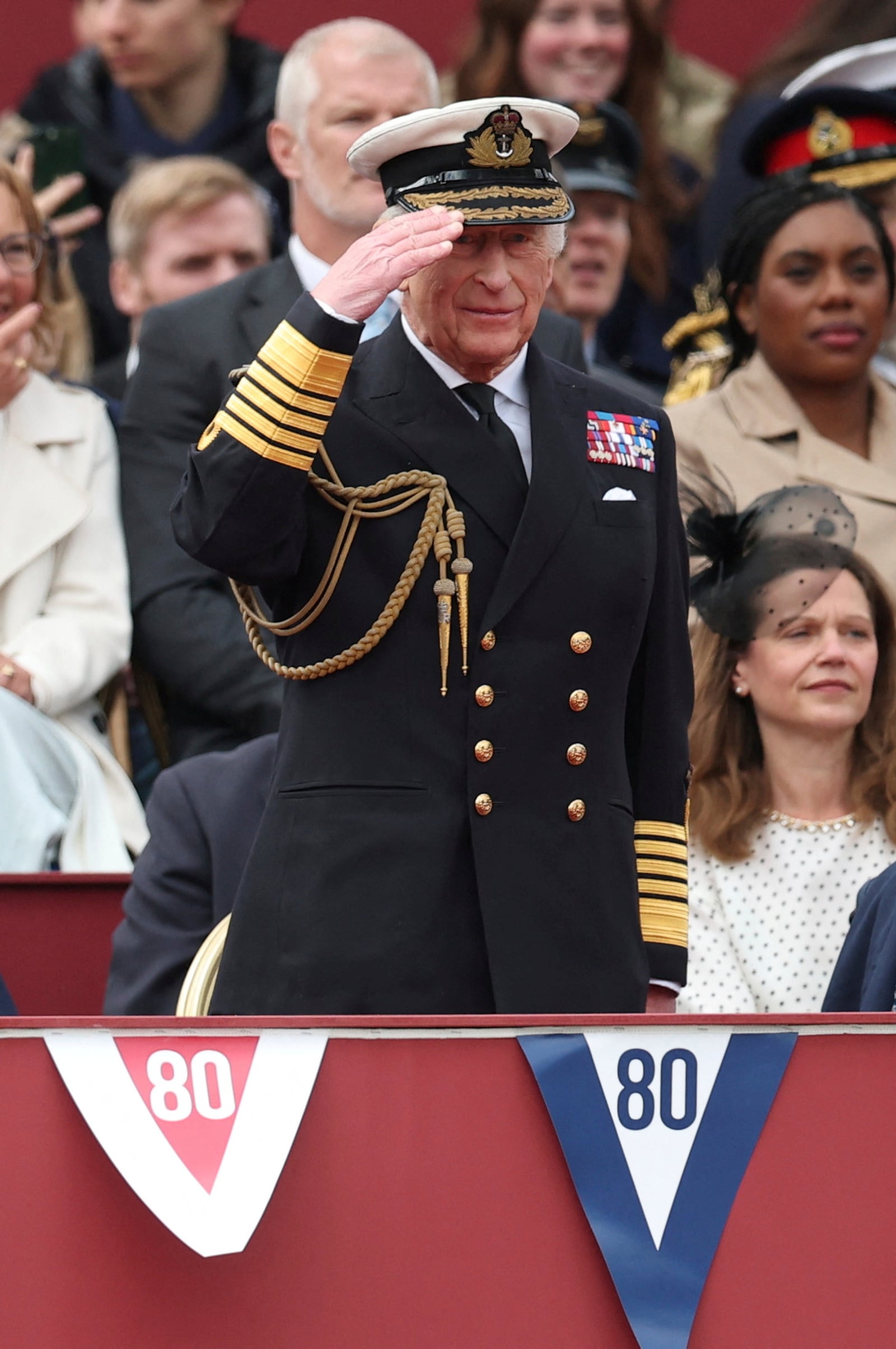 Britain's King Charles III salutes as he attends the military procession marking the 80th anniversary of VE Day, in London, Monday, May 5, 2025. (Toby Melville/Pool Photo via AP)