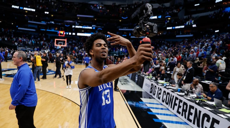 Duke's Sean Stewart records a video following a Sweet 16 college basketball game against Houston in the NCAA Tournament in Dallas, Friday, March 29, 2024. Duke won 54-51. (AP Photo/Brandon Wade)