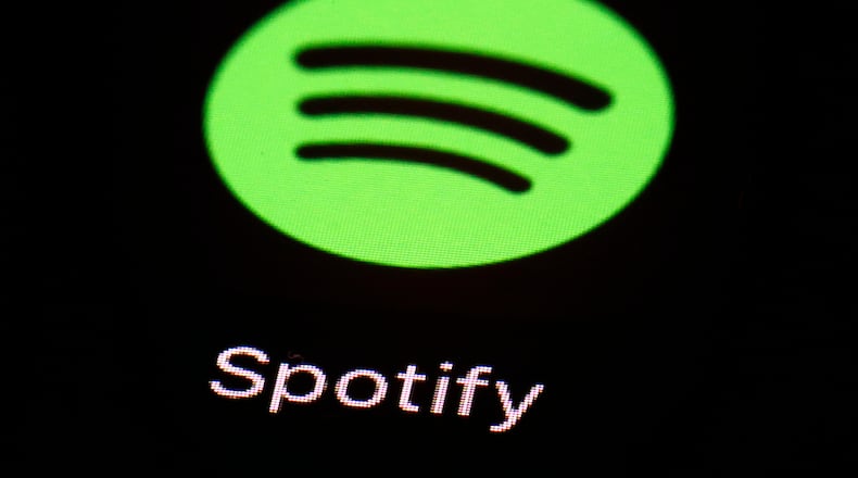 FILE- This March 20, 2018 file photo shows the Spotify app on an iPad in Baltimore. (AP Photo/Patrick Semansky, File)