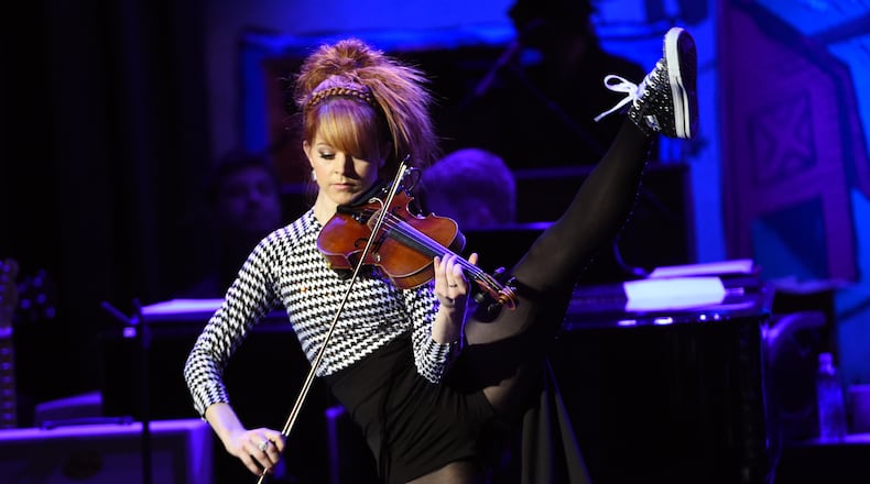 Violinist Lindsey Stirling will perform Aug. 19 at The Rose Music Center at The Heights. (Photo by Chris Pizzello/Invision/AP)