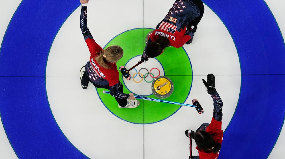 United States' Tabitha Peterson, Tara Peterson and Taylor Anderson-Heide compete during a women's curling round robin match against Canada at the 2026 Winter Olympics, in Cortina d'Ampezzo, Italy, Friday, Feb. 13, 2026. (AP Photo/David J. Phillip)