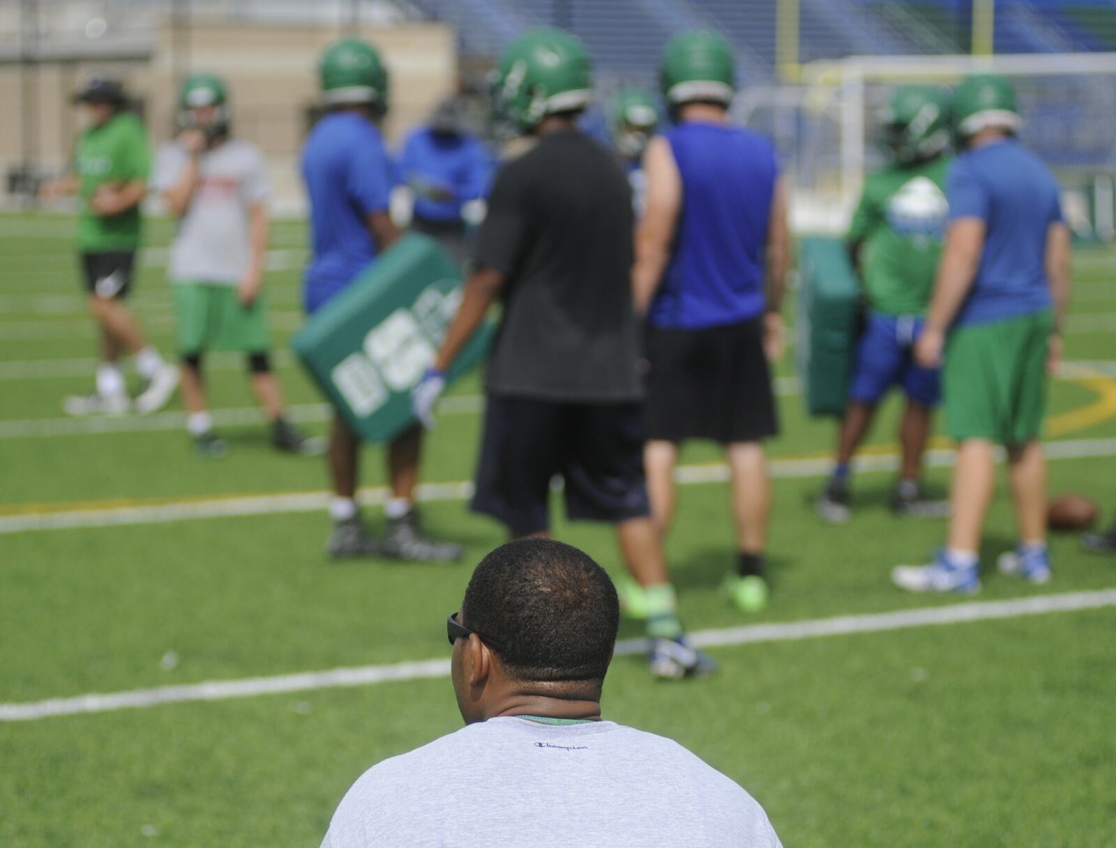 Coach Marcus Colvin observes Chaminade Julienne’s first day of preseason high school football practice. MARC PENDLETON / STAFF