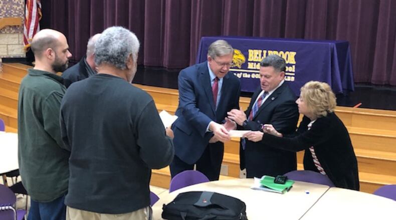State Rep. Bob Cupp (center) talks to State Rep. Rick Perales and Beavercreek school board President Jo Ann Rigano as former Beavercreek Mayor Brian Jarvis and others look on. JEREMY P. KELLEY / STAFF