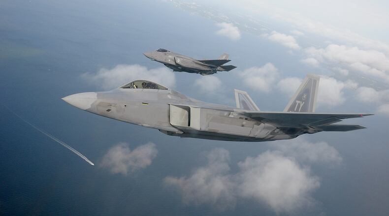 Manned aircraft, such as this F-22 Raptor or F-35 Lightning II, could one day operate with autonomous attritable unmanned aircraft acting as wingmen. The award of the Skyborg Prototyping, Experimentation and Autonomy Development indefinite-delivery/indefinite-quantity contract sets the stage to begin prototyping and operational experimentation for the Skyborg Vanguard program. U.S. Air Force photo/1st Lt. Savanah Bray