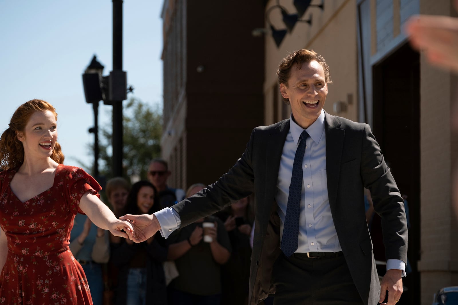 This image released by Neon shows Annalise Basso, left, and Tom Hiddleston in a scene from "The Life of Chuck." (Neon via AP)