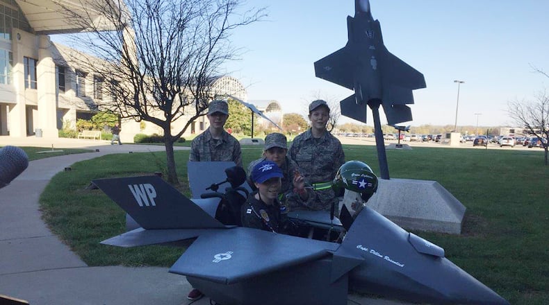 Dillon Rosenlieb (center), surrounded by his siblings, showcases his F-35 Lightning II fighter jet Halloween costume. The F-35 Division at Wright-Patterson Air Force Base and volunteers from the Magic Wheelchair organization worked together to build the costume for Dillon. (Courtesy photo)