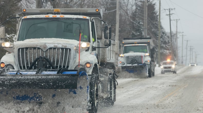 Huber Heights snow plows work together to clear Chambersburg Road Monday, Jan. 6, 2025. BILL LACKEY/STAFF
