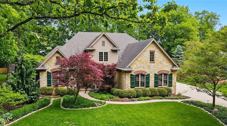 This Centerville two story is heavily landscaped and the cul-de-sac lot features mature trees, paver walkways and water features.