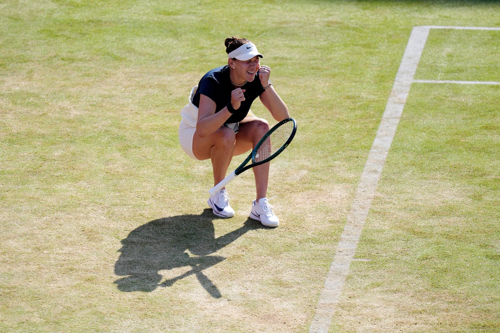 Amanda Anisimova of the U.S. reacts after winning her semifinal match against China's Qinwen Zheng on day six of the HSBC Championships at The Queen's Club, London, Saturday June 14, 2025. (John Walton/PA via AP)