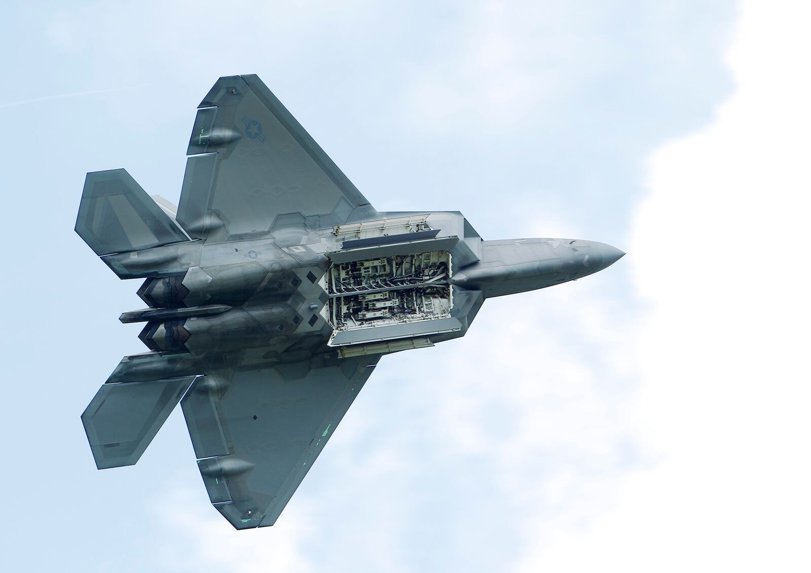 The F-22 Raptor with the bomb and missile bay open on Saturday at the Vectren Dayton Air Show.   TY GREENLEES / STAFF
