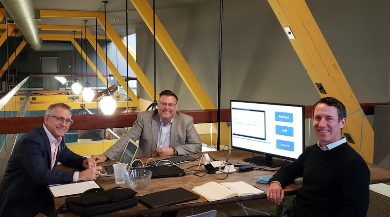 James O'Hara, center, founder and chief executive of Consumer Optix, with Jamie Denning, center, with Jim Brennanman, vice president of One Resource Group. CONTRIBUTED