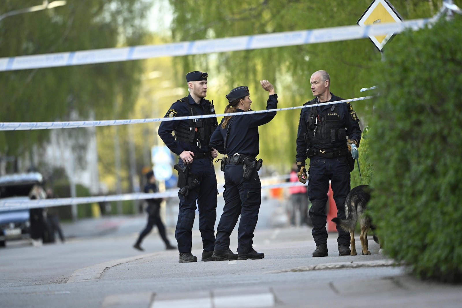 Police at the scene after a shooting incident, at Vaksala Square, in central Uppsala, Sweden, Tuesday, April 29, 2025. (Fredrik Sandberg/TT News Agency via AP)