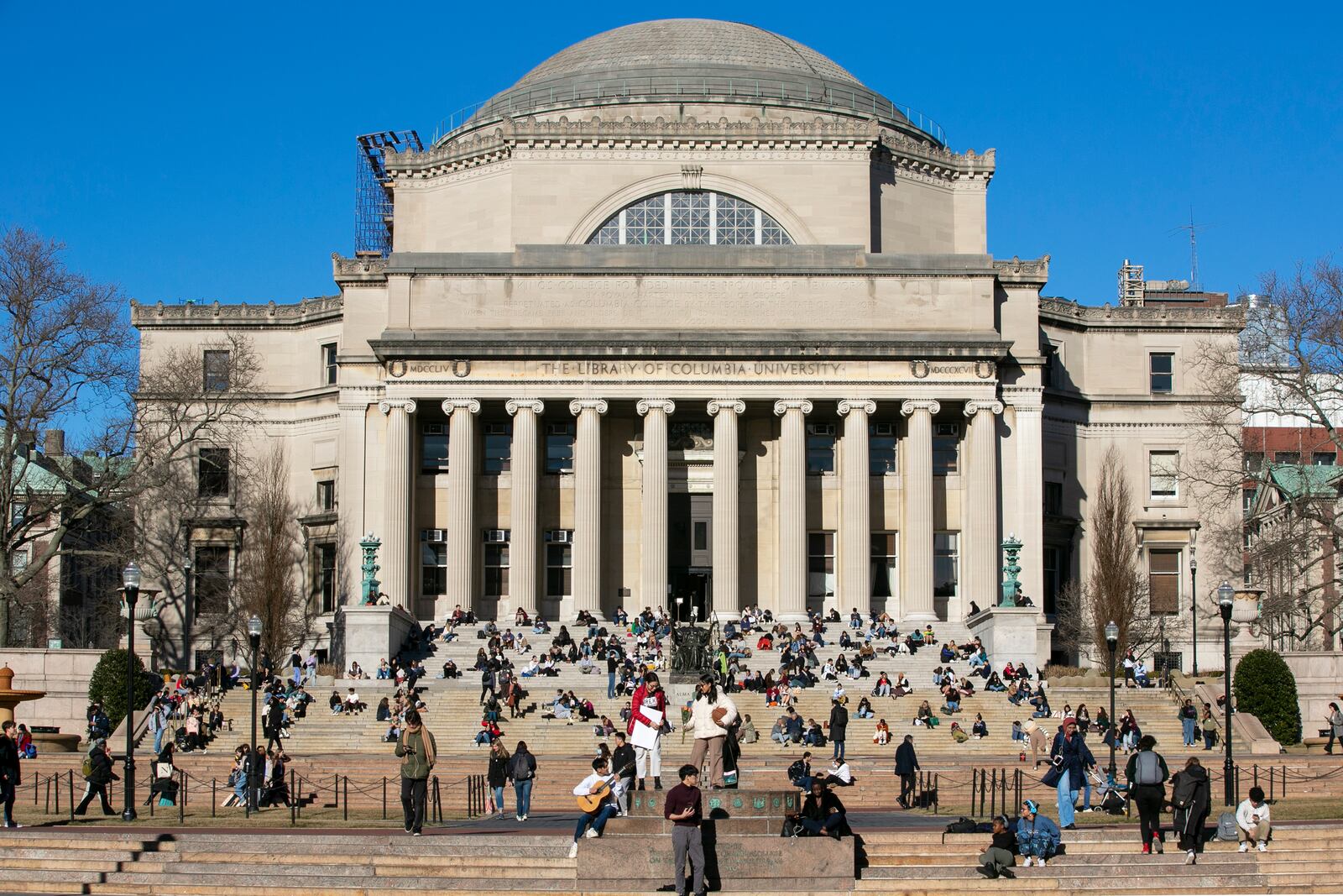 FILE - Students sit on the front steps of Low Memorial Library on the Columbia University campus in New York City, Feb. 10, 2023. (AP Photo/Ted Shaffrey, File)