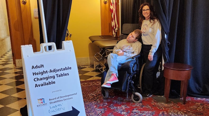 Jennifer Corcoran and her son, Matthew, helped guide people to the adult changing table set up at the Ohio Statehouse in Columbus in March. The pair advocate for accessibility and inclusion for adults with disabilities. Photo provided by the Montgomery County Board of Developmental Disabilities.
