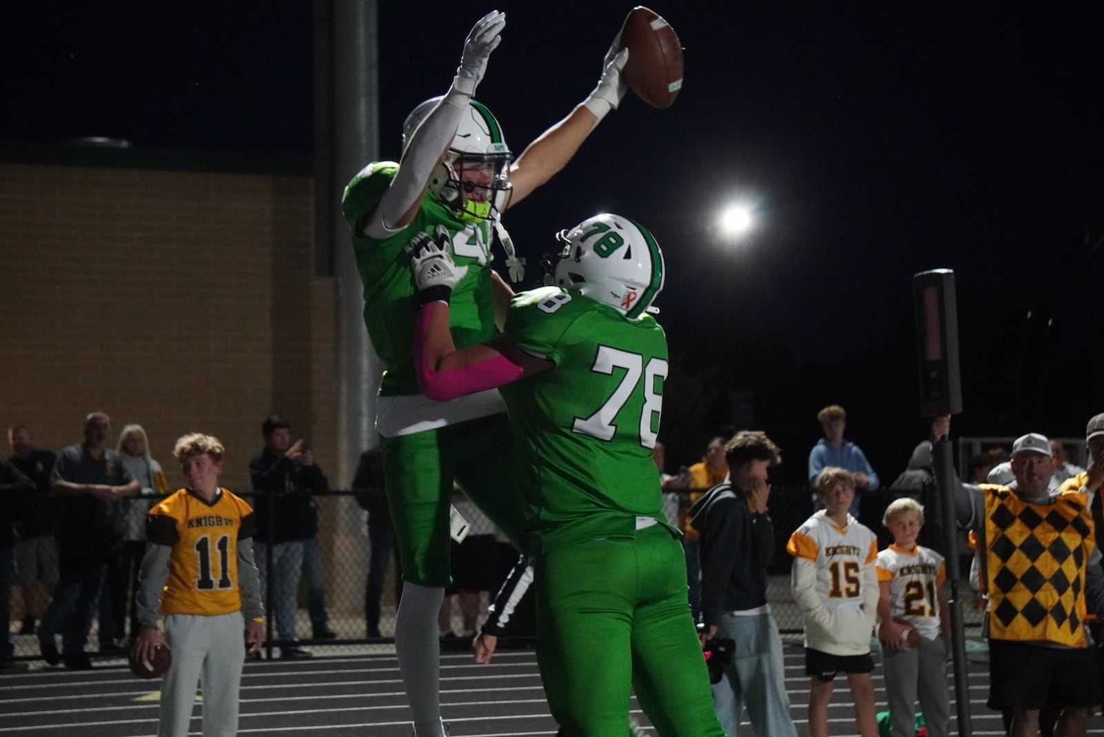 Badin’s James Brink is hoisted up by teammate Andrew Lipp after Brink scored a touchdown against Alter on Friday night at the Matandy SportsPlex. CHRIS VOGT / CONTRIBUTED