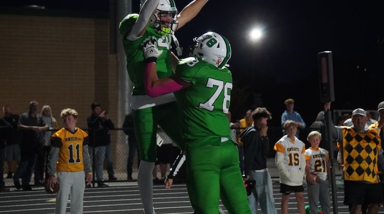 Badin’s James Brink is hoisted up by teammate Andrew Lipp after Brink scored a touchdown against Alter on Friday night at the Matandy SportsPlex. CHRIS VOGT / CONTRIBUTED