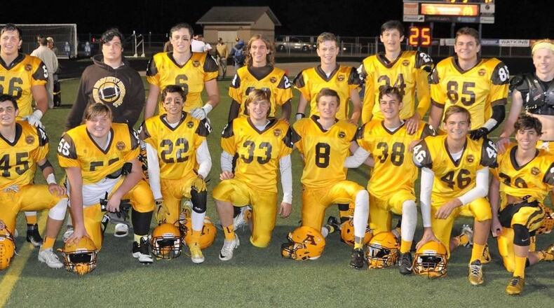 The Alter football team features nine sets of brothers. From left (back to front): Lane and Alex Harshbarter, Alex and Austin Helm, Max and Jack Miller, Alden and Liam Simms, Rob and Michael Alig, Tom and Ryan Mangin, Michael and Joe Beam, J.P. and Matthew Schimpf and Danny and Jack McKelvey. CONTRIBUTED PHOTO