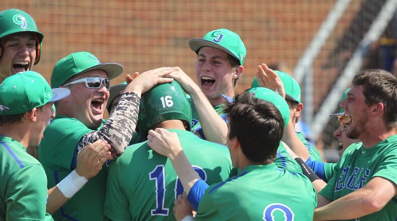 Chaminade Julienne celebrates a two-run home run by Garrett Wissman in the first inning against Columbus DeSales in a Division II regional final at Mason High School on Saturday, May 27, 2017. David Jablonski/Staff