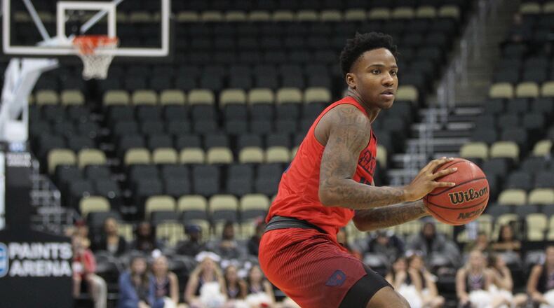 Dayton’s John Crosby runs the offense against Duquesne on Saturday, Jan. 14, 2017, at PPG Paints Arena in Pittsburgh. David Jablonski/Staff