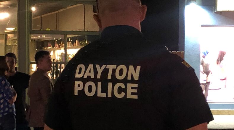 A Dayton police officer in the Oregon District. CORNELIUS FROLIK / STAFF