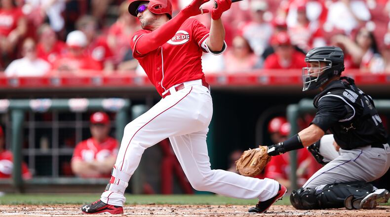CINCINNATI, OH - APRIL 20: Adam Duvall #23 of the Cincinnati Reds hits a solo home run against the Colorado Rockies in the second inning at Great American Ball Park on April 20, 2016 in Cincinnati, Ohio. (Photo by Joe Robbins/Getty Images)
