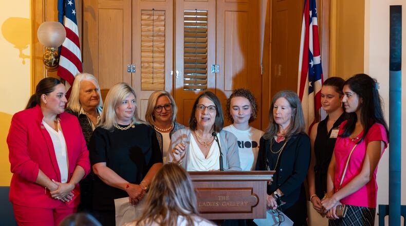 State Senator Nickie J. Antonio, D-Lakewood) center, announces funding for schools to provide period products to girls in grades six to 12. Also pictured are Senator Stephanie Kunze, R-Dublin, (center left) Hamilton County Commissioner Denise Driehaus (center right) and members of the Hamilton County Commission on Women and Girls. Courtesy Nickie J. Antonio.