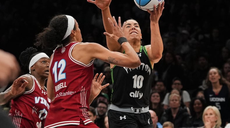 Vinyl BC wing Rae Burrell (12) defends Phantom BC guard Kelsey Plum (10) during the second half of a semifinal in their Unrivaled 3-on-3 basketball game, Monday, March 2, 2026, in New York. (AP Photo/Frank Franklin II)