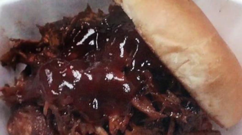 Pulled pork sandwich at Al’s Smokehouse. BILL LACKEY/STAFF