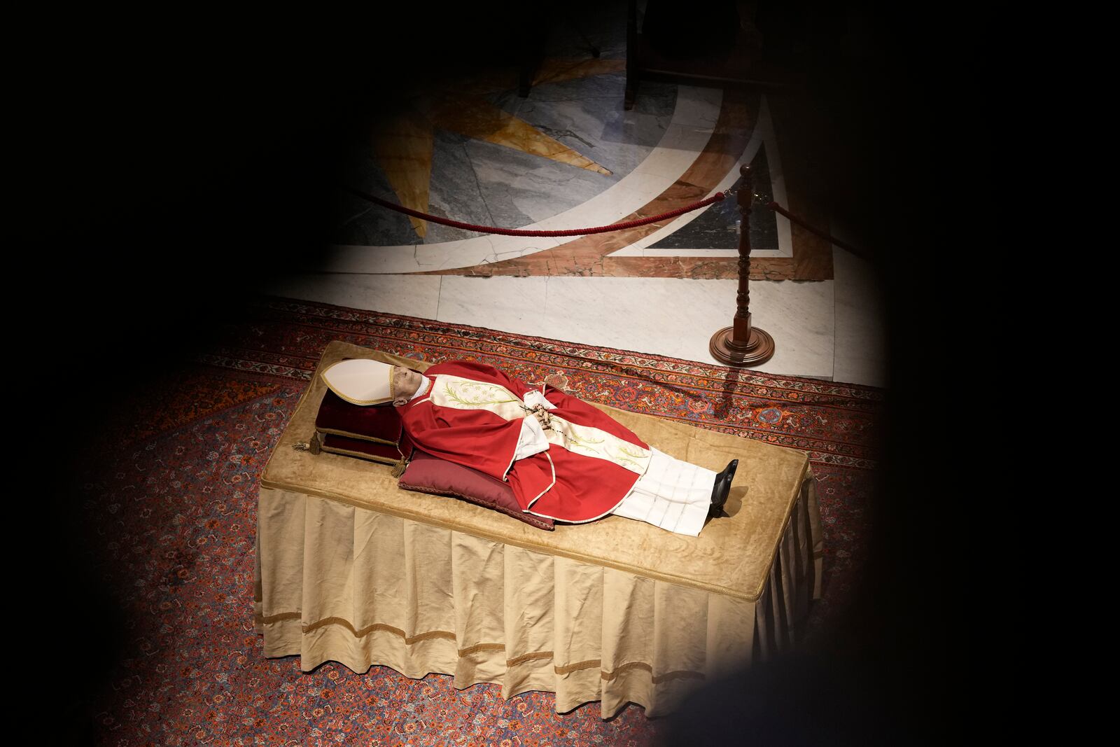 FILE - The body of late Pope Emeritus Benedict XVI lies out in state inside St. Peter's Basilica at The Vatican, Tuesday, Jan. 3, 2023. (AP Photo/Andrew Medichini, file)