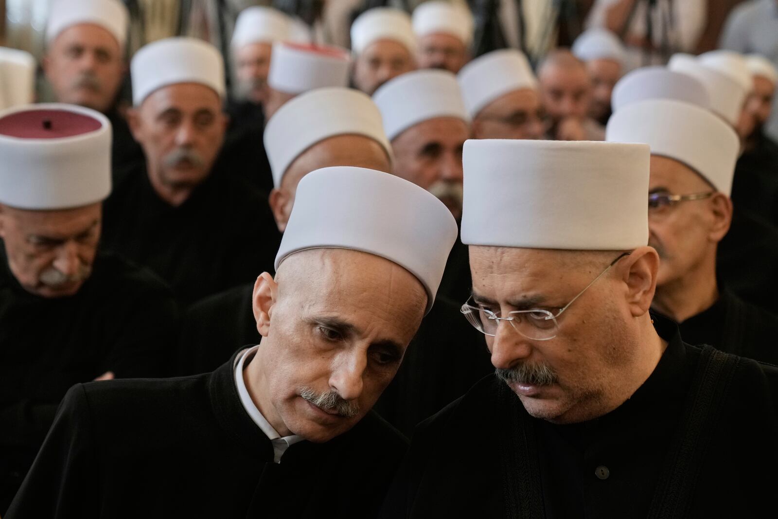 Druze clerics take part in a gathering of minority religious leaders in Beirut, Lebanon, Friday, July 18, 2025, as they speak about sectarian clashes between Druze factions, Sunni Muslim Bedouin clans, and government forces in Syria. (AP Photo/Bilal Hussein)