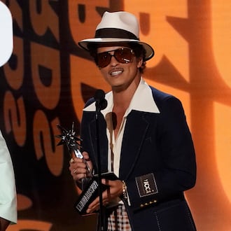 Bruno Mars accepts the award for album of the year for "An Evening with Silk Sonic" at the BET Awards on Sunday, June 26, 2022, at the Microsoft Theater in Los Angeles. (AP Photo/Chris Pizzello)