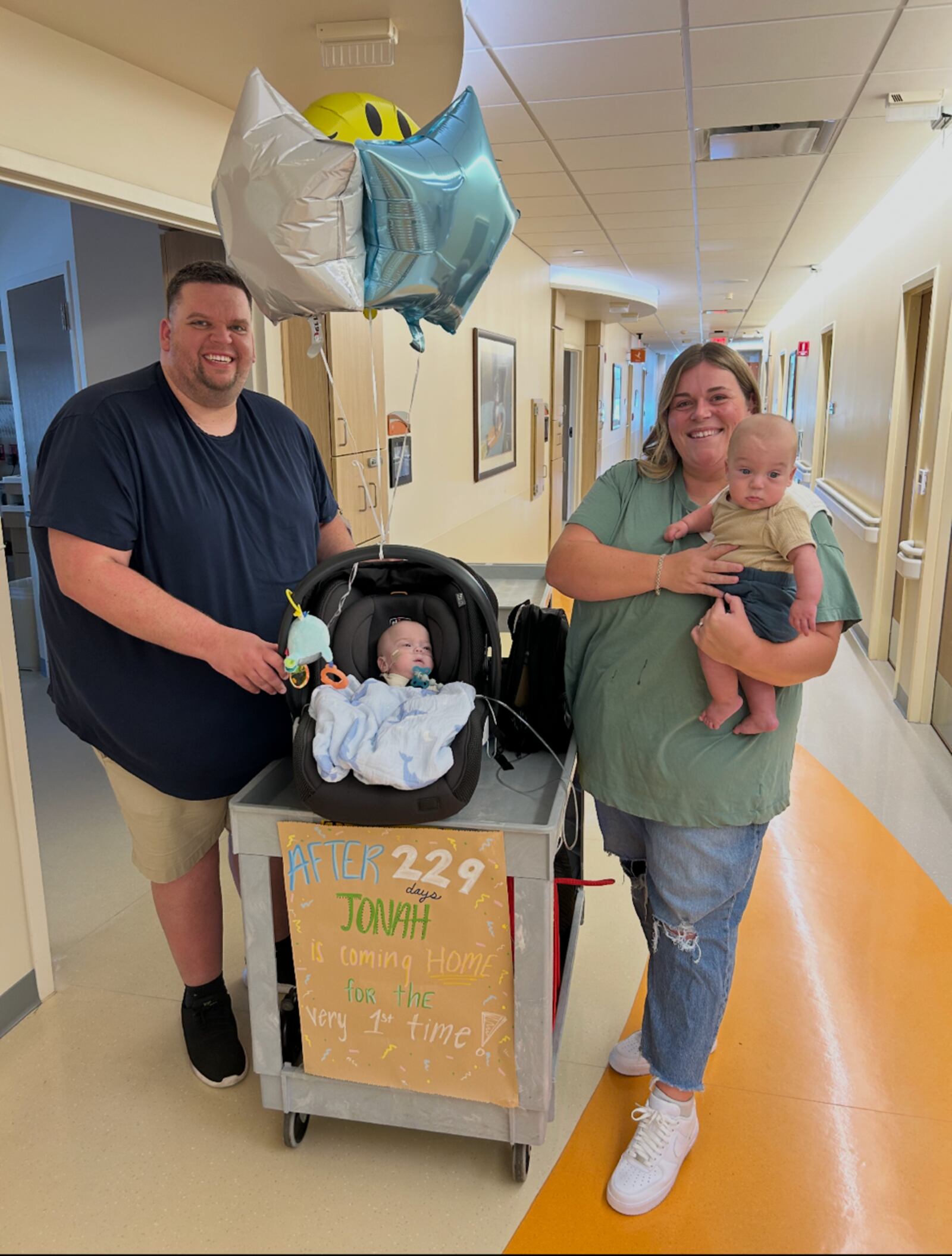 Cody (far left) and Halee Rudduck (right) with their twin boys Jonah (middle) and Drew, who is pictured being held by Halee, the day baby Jonah was able to come home after spending 229 days in the neonatal intensive care unit at Dayton Children's. Drew also spent 74 days in the NICU at Kettering Health Main Campus. Jonah and Drew were born on Jan. 24, 2025 at Kettering Health Main Campus at a little more than 27 weeks into Halee's pregnancy due to complications stemming from Twin-to-Twin Syndrome. Now, both boys are home, and Halee said they are excited to start Christmas traditions with them. CONTRIBUTED