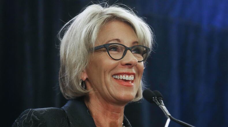 WASHINGTON, DC - FEBRUARY 15: Education Secretary Betsy DeVos speaks at the Magnet Schools Of America Conference on February 15, 2017 in Washington, DC. DeVos addressed a recent protest at a public school she visited in Washington, DC last week following her controversial nomination to the post by President Donald Trump. (Photo by Mario Tama/Getty Images)
