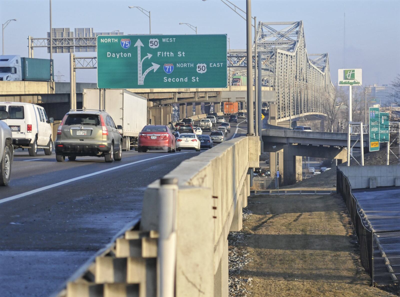 The Brent Spence Bridge, pictured here from the Covington, Kentucky side of the Ohio River, has been deemed “functionally obsolete” by the Federal Highway Association’s National Bridge Inventory. A $2.6 billion project will refurbish the current bridge and build a new one next to it to alleviate the congestion. The bridge was designed to handle 80,000 vehicles a day when it opened in 1963, but roughly 172,000 vehicles travel every day between Ohio and Kentucky on the bridge.