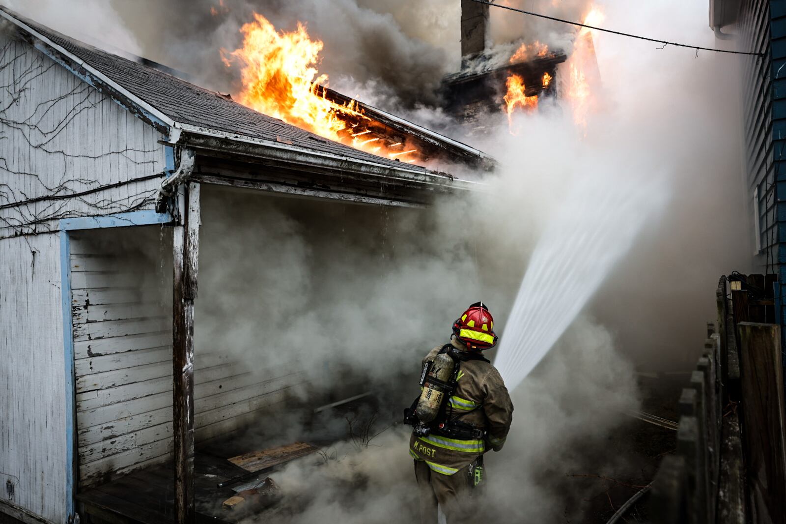 A vacant two-story house with a single-story addition in the back was destroyed by fire Thursday afternoon, Feb. 16, 2023, in the 100 block of South June Street in Dayton. JIM NOELKER/STAFF