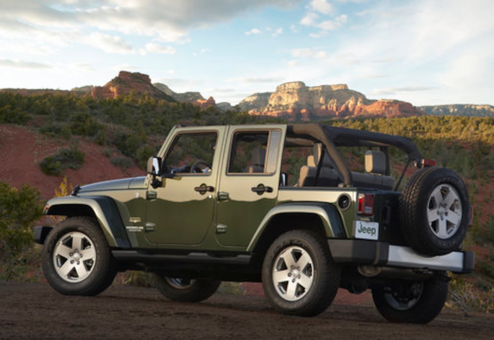 The Jeep Wrangler Unlimited is offered in rear-wheel and 4-wheel drive. All Wrangler Unlimited models use the same body-on-frame construction, full frame or half doors, exposed hinges, fold-down windshield and removable convertible tops.