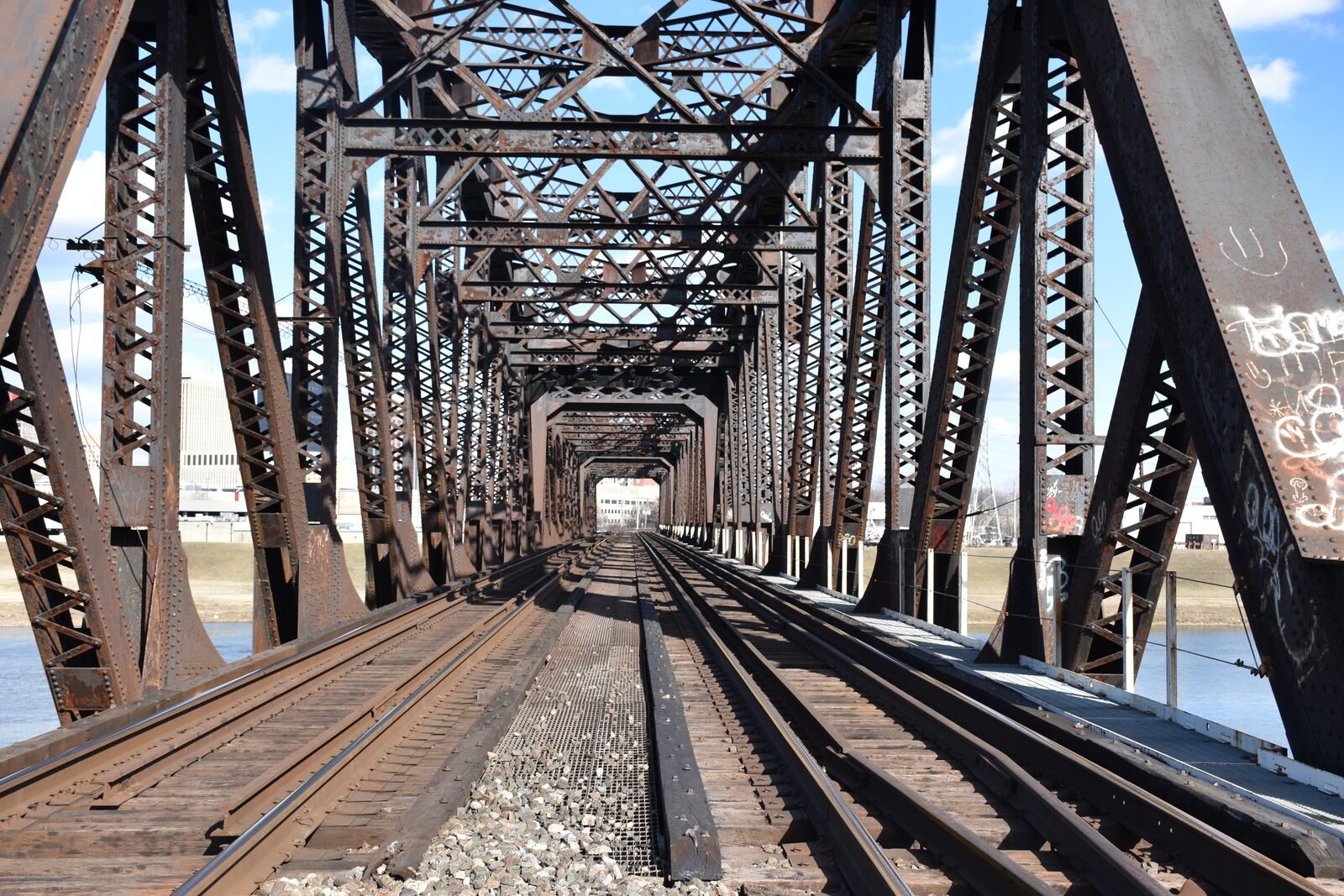 A rail bridge over the Great Miami River that feeds into downtown Dayton. CORNELIUS FROLIK / STAFF