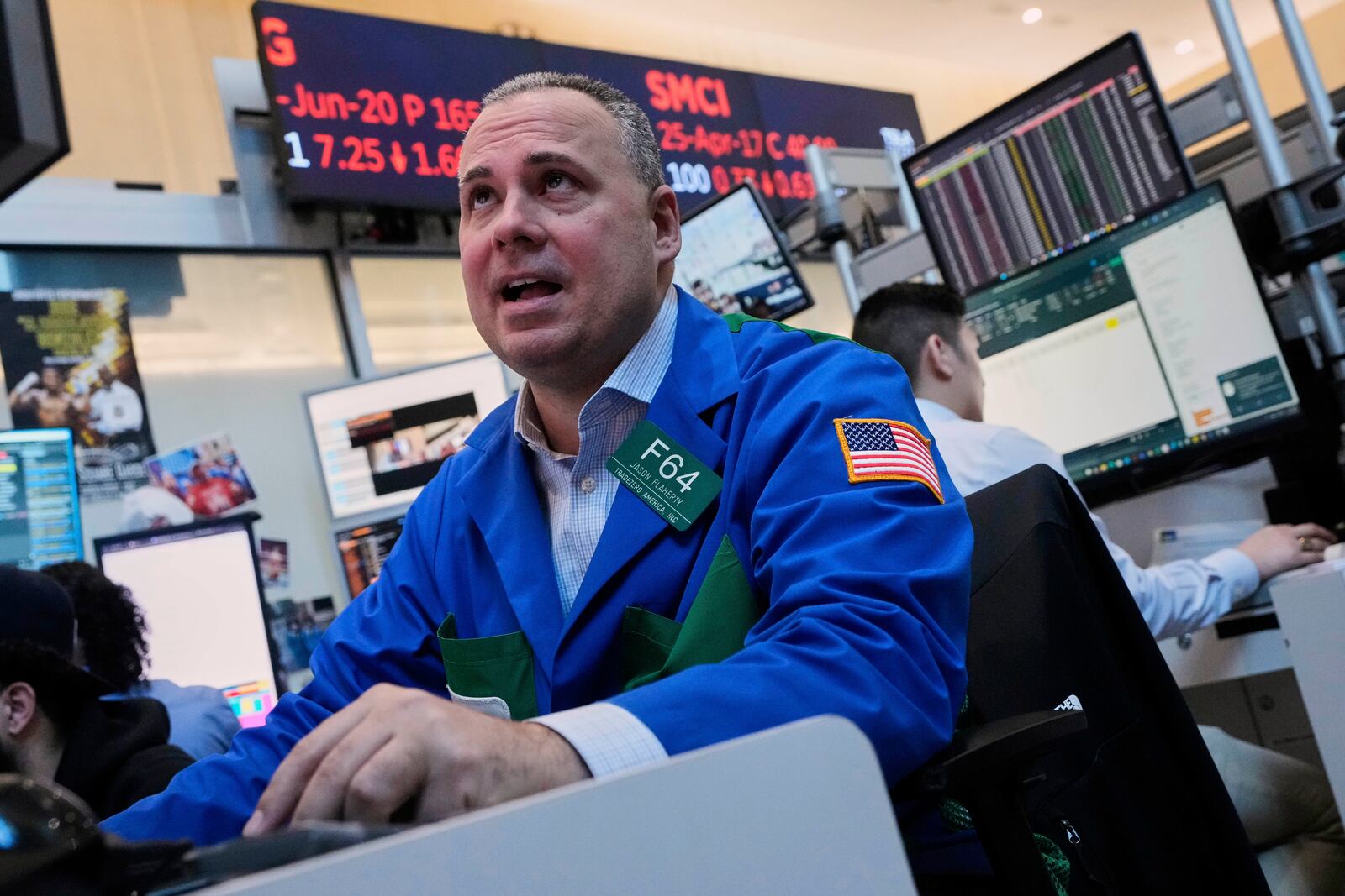 Trader John Flaherty works on the options floor on the floor of the New York Stock Exchange, Thursday, April 10, 2025. (AP Photo/Richard Drew)