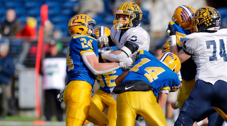 Marion Local's Darren Meier (24) and teammate Landon Arling (14) make a tackle against Kirtland in the Division VI state football championship in Canton on Saturday, Dec. 3, 2022. Meier was named Ohio's Division VI Co-Defensive Player of the Year on Monday. Michael Cooper/CONTRIBUTED