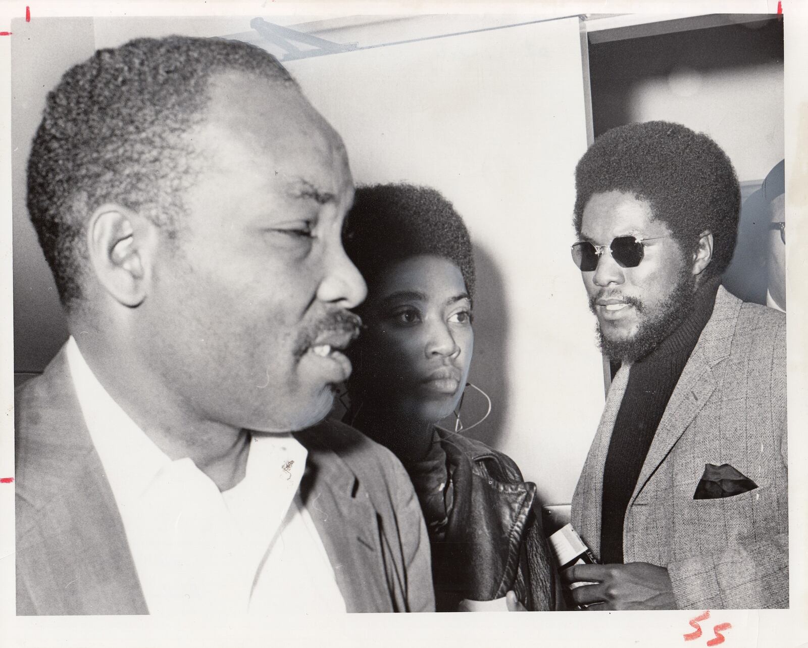 Photo dated Oct. 27, 1967  captioned: W.S. McIntosh and his son and Daughter-in-law, Mr. and Mrs. J. WQ. McIntosh, wait outside Criminal Court. They pleaded not guilty to varying charges and were released on their own recognizance. Staff Photos by Phil Greer."